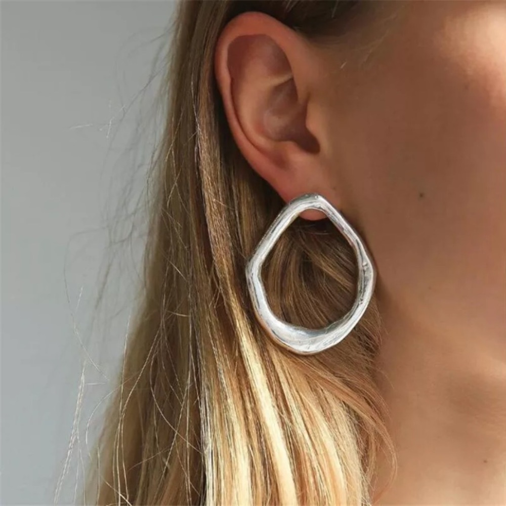 Silver irregular geometric hoop style earrings